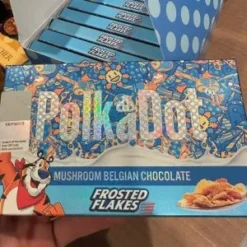 PolkaDot Magic Mushroom Belgian Chocolate Bar Frosted Flakes. This product is a delightful fusion of rich chocolate and the natural goodness of mushrooms. Indulge in the unique taste and texture of this delectable treat that will leave your taste buds craving for more.